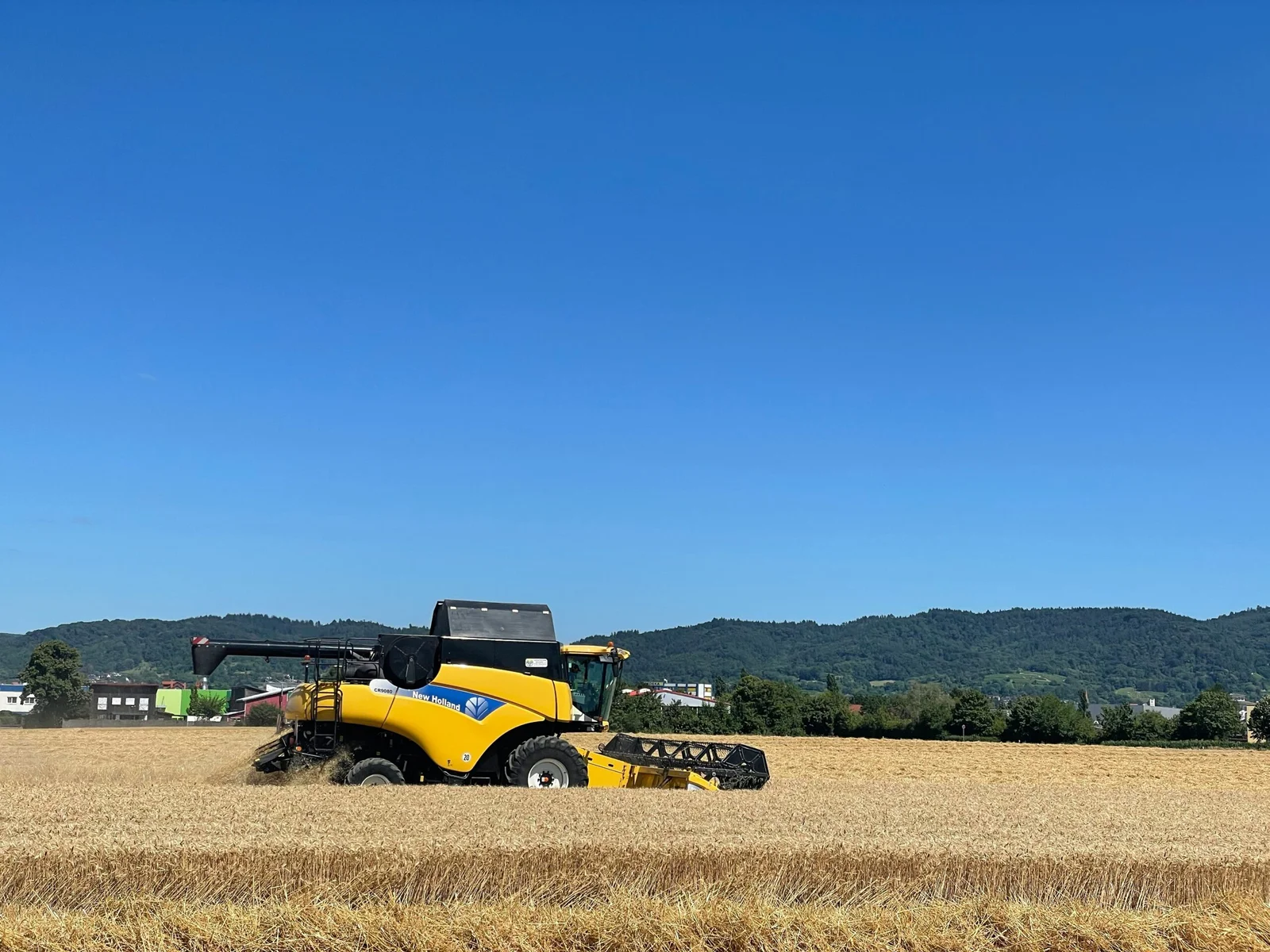 a yellow tractor in a field