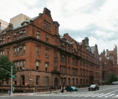 A city street with cars parked on the side of it